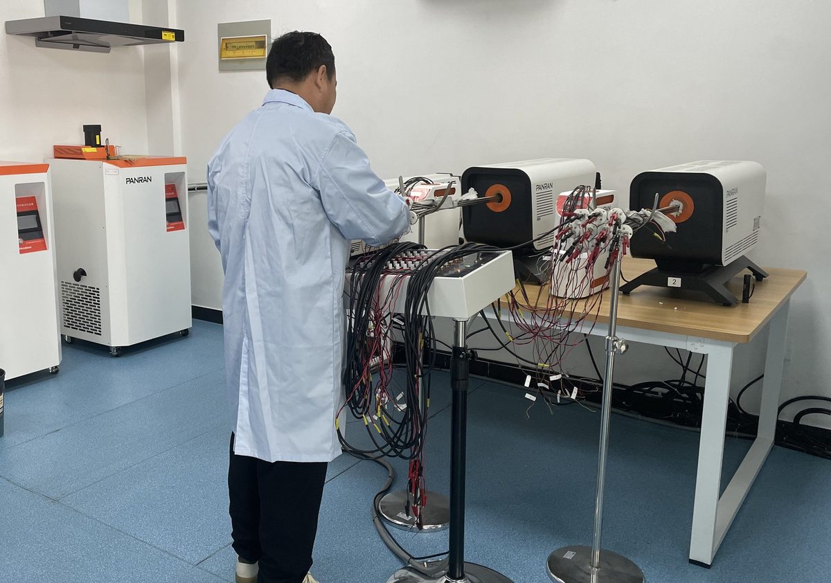 In-house calibration laboratory with a batch of sheathed thermocouples under test