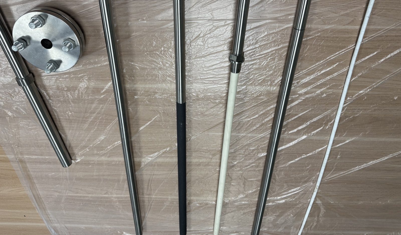 Furnace protection tubes and flange assemblies with ceramic, die-cast and bare sheathed configurations